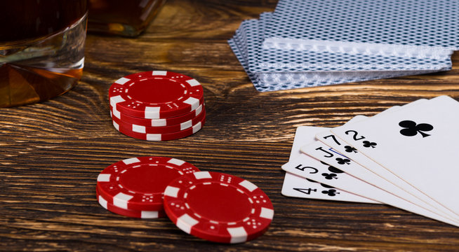 A big win in poker cards, on a gambling table