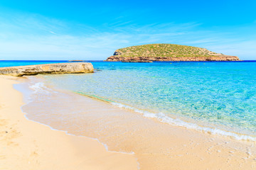 Fototapeta na wymiar Beautiful sandy Cala Comte beach with turquoise sea water, Ibiza island, Spain