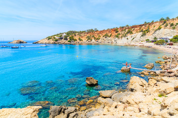Obraz na płótnie Canvas View of Cala d'Hort bay with beautiful azure blue sea water, Ibiza island, Spain