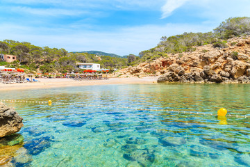 View of beautiful Cala Carbo bay with emerald green sea water, Ibiza island, Spain