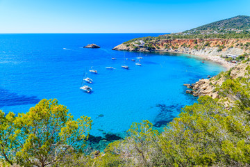 Fototapeta na wymiar View of Cala d'Hort beach with beautiful azure blue sea water, Ibiza island, Spain