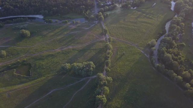 flight of the drone over the fields and rivers