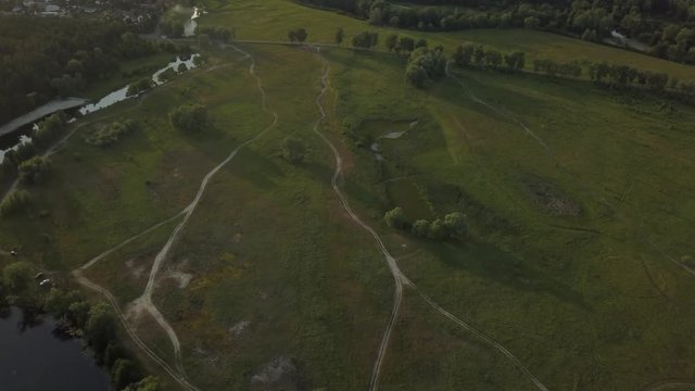 flight of the drone over the fields and rivers