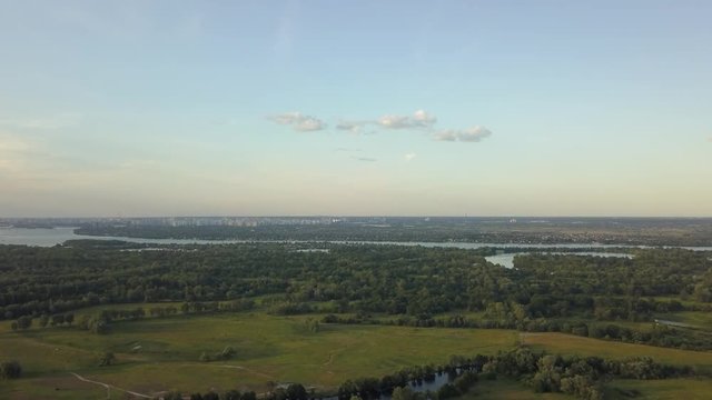 flight of the drone over the fields and rivers