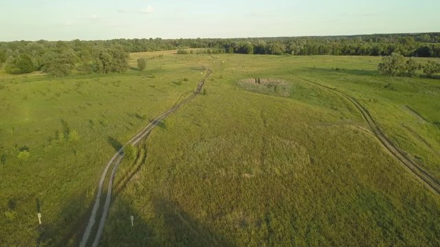 flight of the drone over the fields and rivers