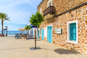 Restaurants and bars on coastal promenade in Santa Eularia town, Ibiza island, Spain.