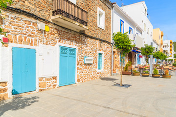 Street with traditional colonial Spanish style houses in Santa Eularia town, Ibiza island, Spain