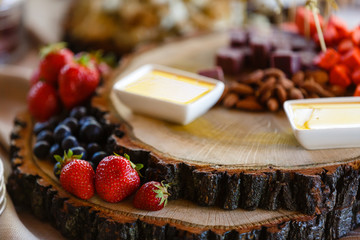Wedding table fruit decoration at restaurant, pineapple, strawberry, grape