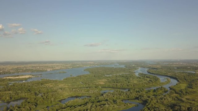 flight of the drone over the fields and rivers