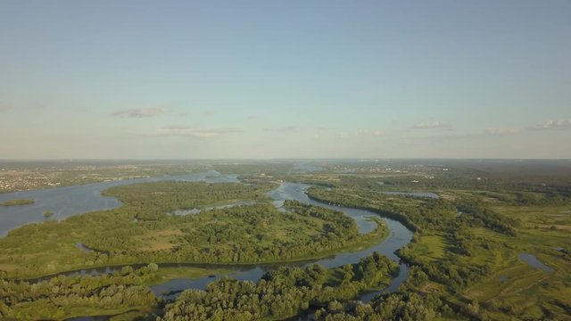 flight of the drone over the fields and rivers