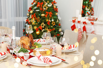 Table served for Christmas dinner in living room