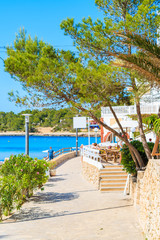 Coastal promenade in Cala Portinatx bay, Ibiza island, Spain