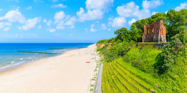 Panoramic view of ruins of old church in Trzesacz village on Baltic Sea beach, Poland