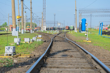 Fototapeta na wymiar Railway station with goods wagons and infrastructure
