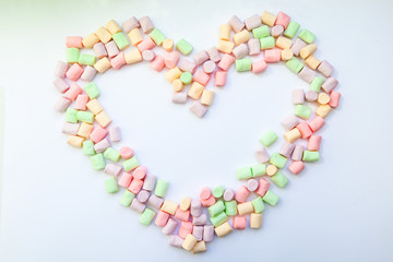 frame heart made of marshmallows . the concept of childhood.