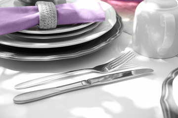 Beautiful table setting with silver cutlery, closeup © Africa Studio