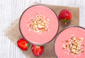 Strawberry smoothie with fresh fruit .