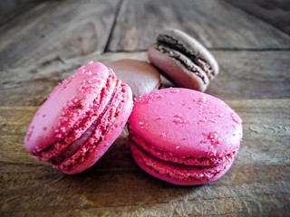 Four french macarons on wooden