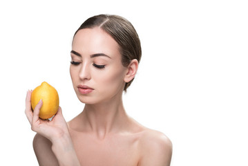 Pensive attractive girl with fruit having ideal face-painting