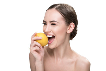 Happy beautiful youthful woman enjoying fresh fruits and wellness