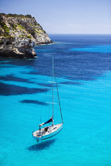 Beautiful bay with sailing yacht in Mediterranean sea. Travel and active lifestyle concept - obrazy, fototapety, plakaty