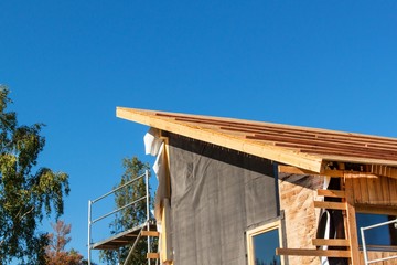 Construction of a wooden roof in an ecological house.