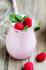 Raspberry milk shake with mint decor.