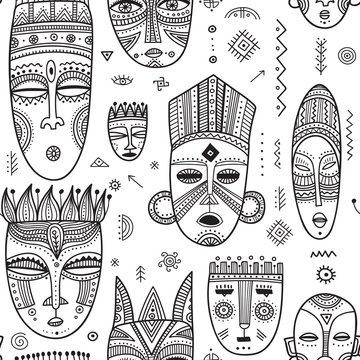 Vector seamless pattern with African ethnic tribal masks decorated with boho ornaments and ritual symbols.