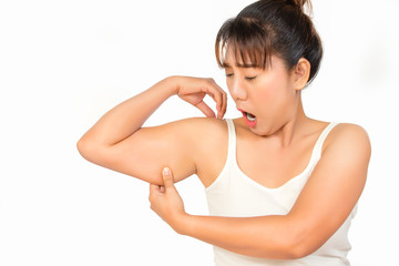 Fototapeta na wymiar asian woman checking her upper arm