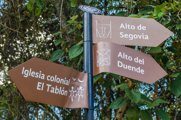 Direction signs pointing to various archeological sites in Tierradentro, Colombia.