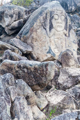 Figure carved in a rock located at El Chaquira site near San Agustin, Colombia