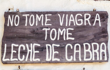 GUANE, COLOMBIA  - SEPTEMBER 19, 2015: Text on the sign in Guane village says: Do not take viagra, drink a goat milk.