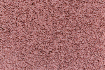 Roter Putz an einer Hauswand