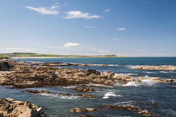Looking across Boyndie Bay at low tide with Knock Head in the background from Scotstown in Banff in Aberdeenshire, Scotland