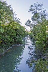 Italy, small river floating in a beautiful landscape on Appennino hills