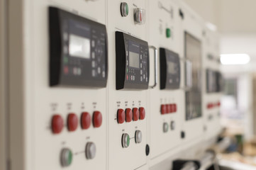 Main electric control board inside a factory (blurred picture)