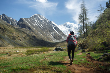 Traveller adventure hiking mountain with backpack and hat. Outdoor retrohipster lifestyle