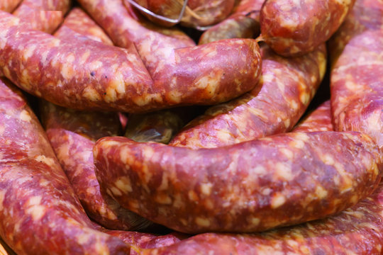 Food plat with delicious salami, pieces of sliced ham, sausage, cooked in a traditional way.