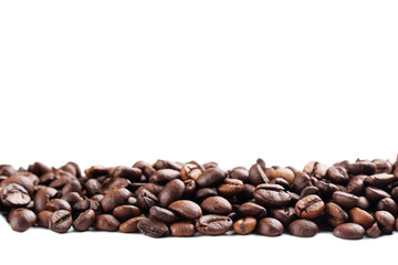 Roasted coffee beans on a white background