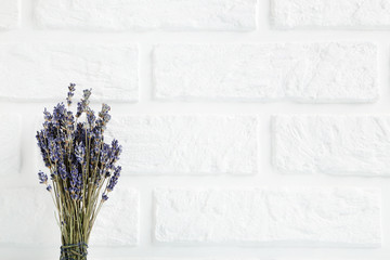 Bunch of lavender flowers on the brick wall background