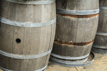 Fototapeta premium Old wooden barrels and tanks for processing wine