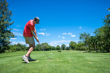 Fototapeta premium golfer tee off with golf club