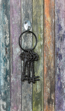 Old, rusty keys on an old wall