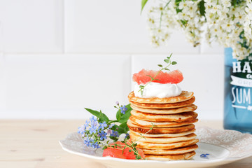 stack of pancakes on a ceramic plate