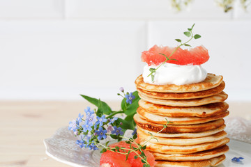 stack of pancakes on a ceramic plate