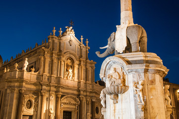 The famous lava stone elephant in the main square of Catania, Sicily, with a view of St. Agatha...