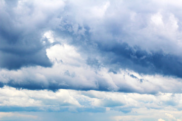 blue sky with clouds closeup, thunderclouds.