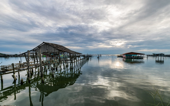 Homestay and floating basket in lake at Kohyo, Songkhla, Thailand with beautiful sky and clouds. This is traditional fisheries area.