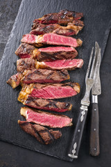 Barbecue Wagyu Tagliata di Manzo Entrecote as close-up on a slate