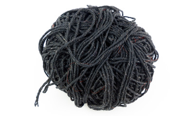 Ball of black yarn and needles isolated on white background.